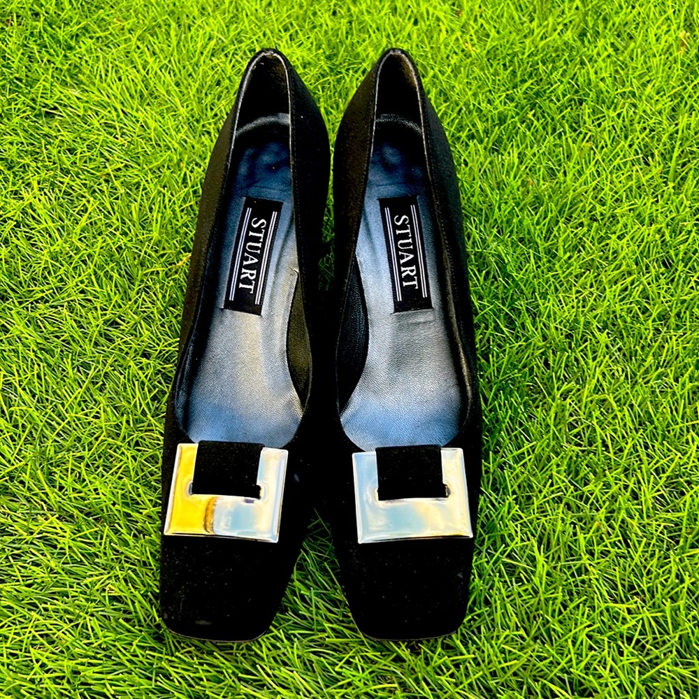 Black square heel with buckle design and design on heel.